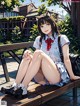 A girl sitting on a bench in a school uniform.