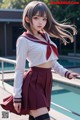 A woman in a school uniform posing by a pool.