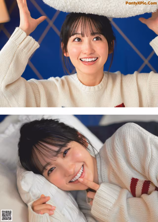 A woman laying on top of a bed next to a pillow.